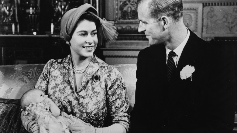 Princess Anne being held by her mother